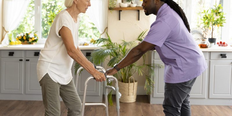 male-social-worker-taking-care-old-woman